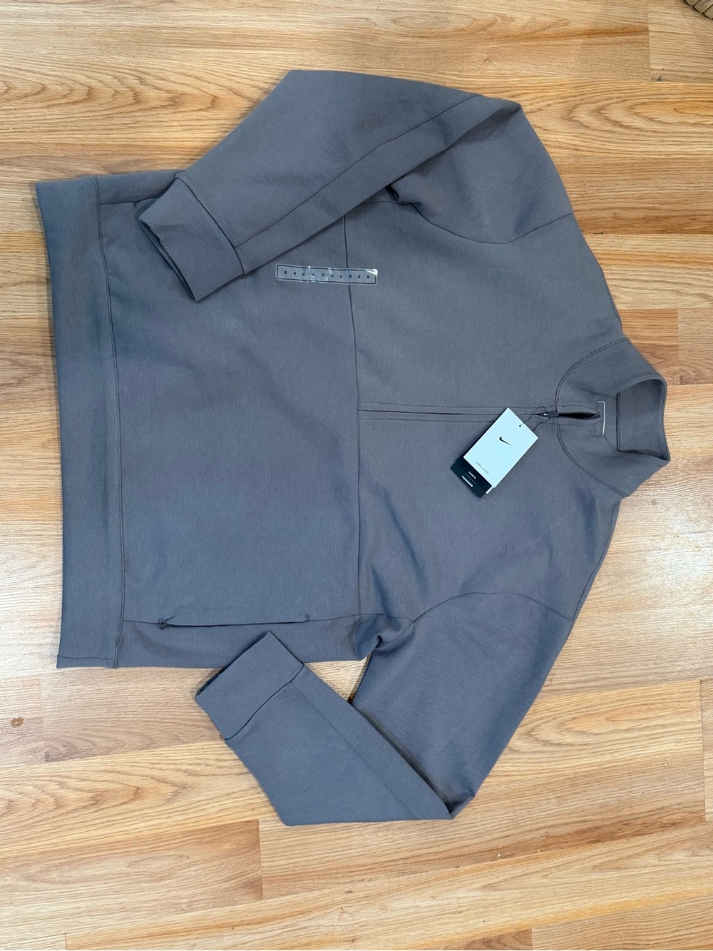 Nike 24.7 ImpossiblySoft Dri-FIT 1/2 Zip Top in taupe gray with prominent tag
